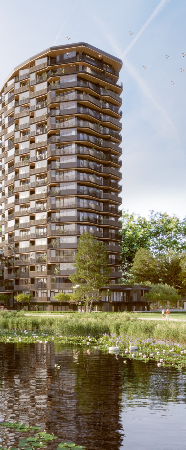 Twee flats in een groene omgeving met een sloot op de voorgrond en bomen aan de rechterzijde